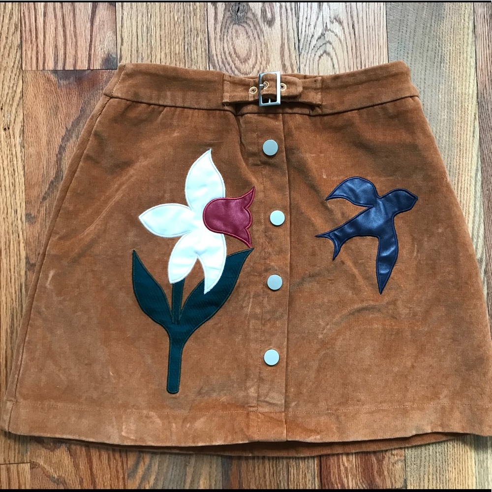 Cord skirt with embroidered accents
